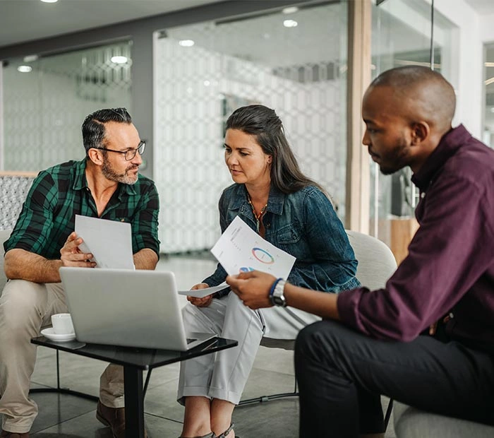 Professionals reviewing financial reports together